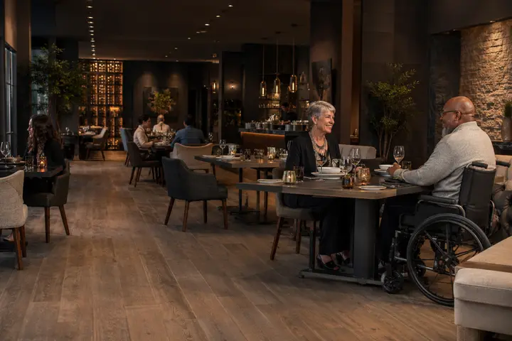 Hotel restaurant table set with adaptive dinnerware and clear access