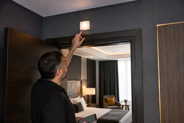 Visual alert device location checked in a hotel guest room
