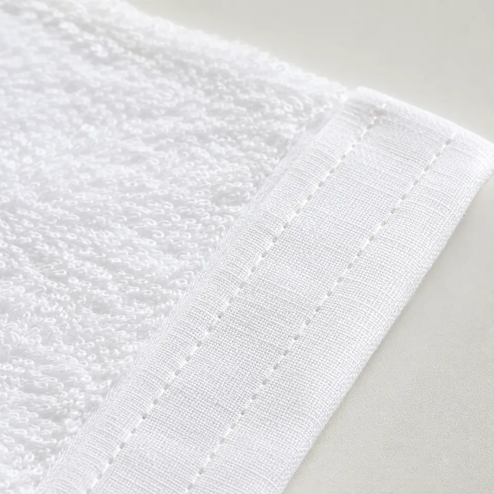 Close-up of a reinforced double-stitched hotel towel hem