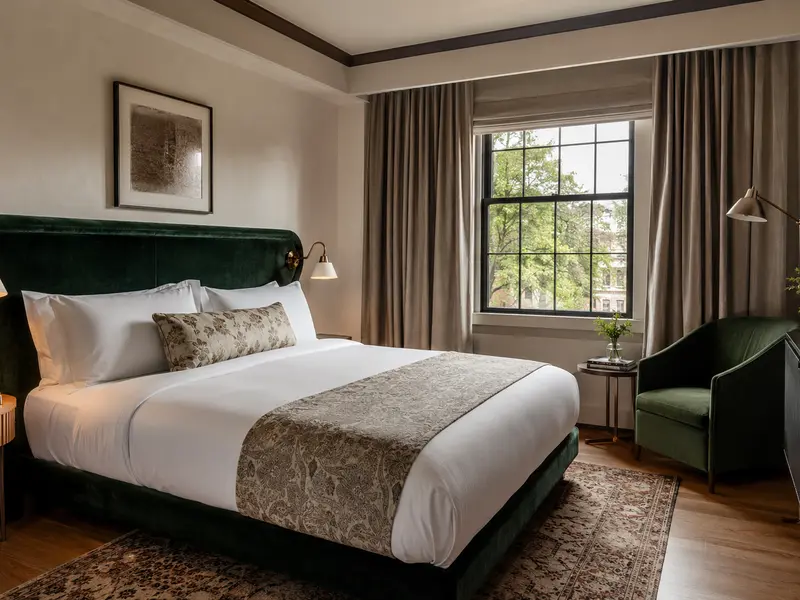 Boutique hotel room with distinctive layered bed linens