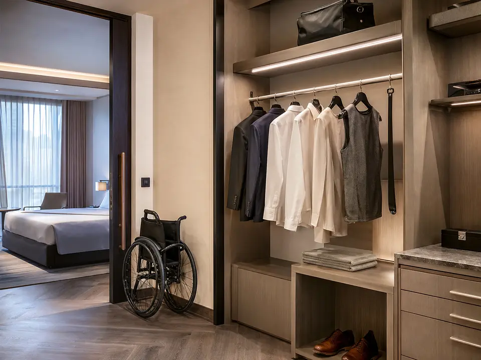 Accessible hotel closet with low rail and long-handled shoehorn