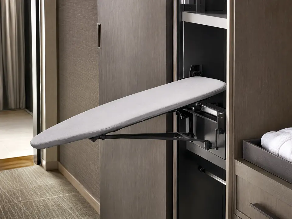 Compact hotel ironing board folding safely into closet storage