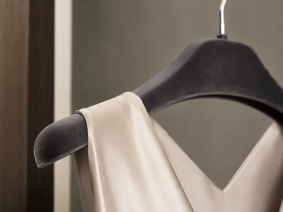 Close detail of a non-slip hotel hanger surface holding fabric