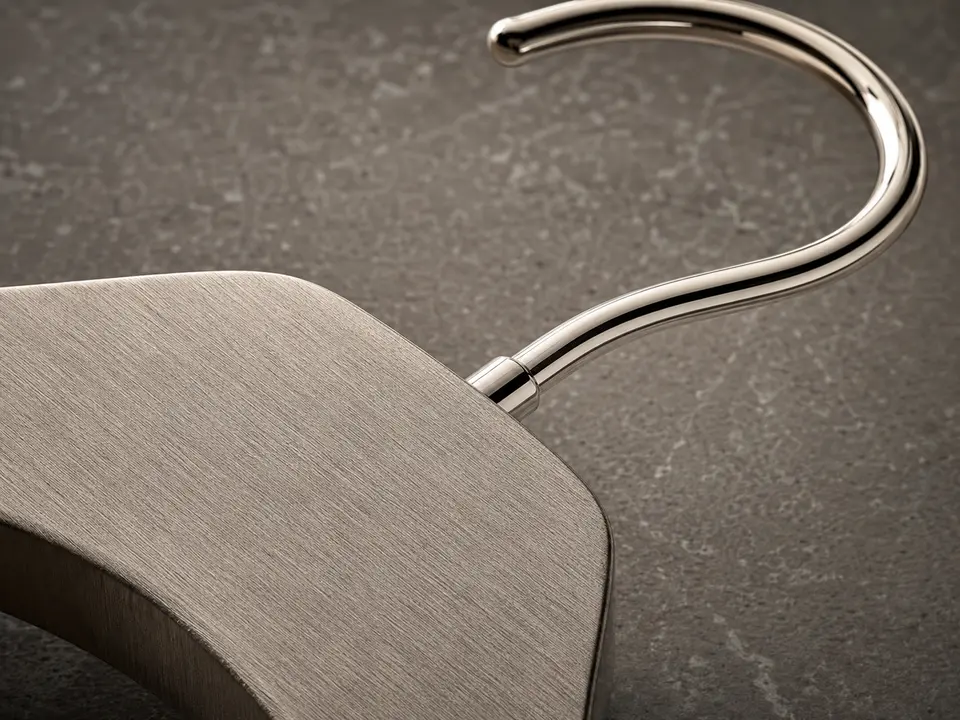 Brushed metal hotel hanger finish and edge detail