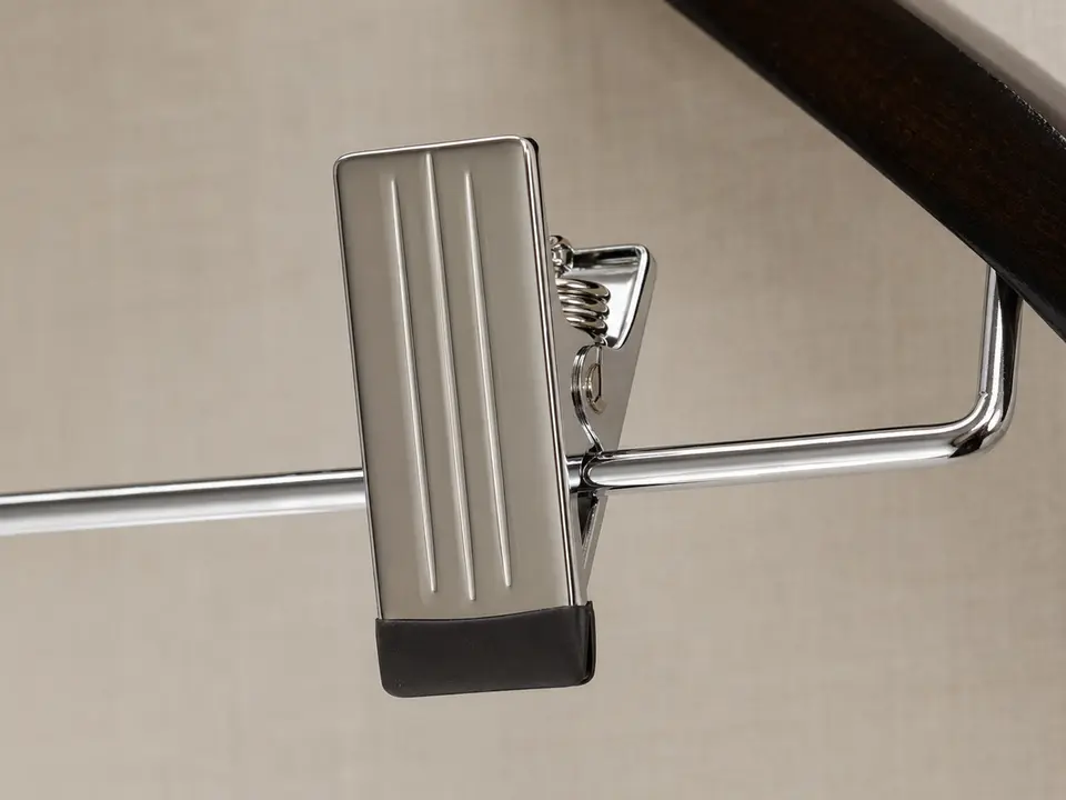 Adjustable hotel hanger clip mechanism with protective pad
