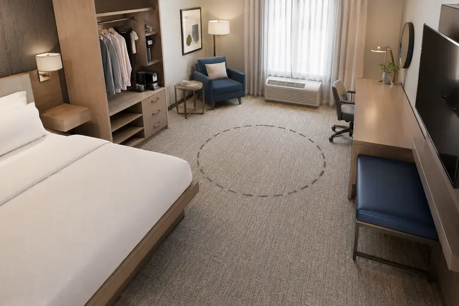 Accessible hotel room with reachable storage and clear circulation