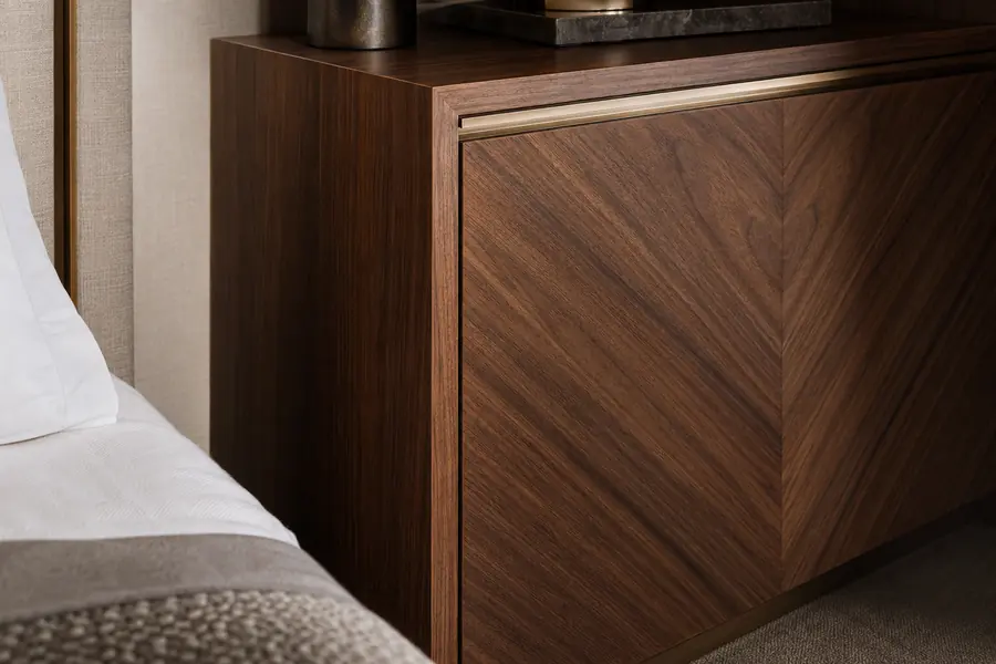 Book-matched walnut veneer detail on hotel casegoods