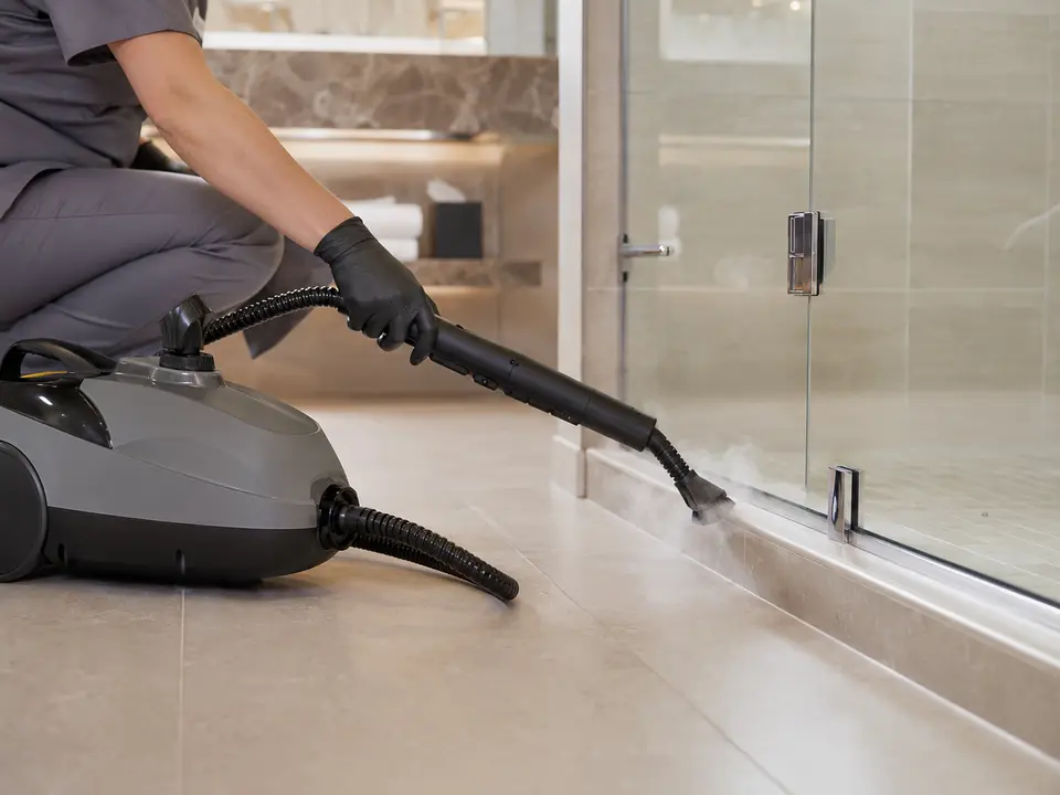 Professional steam cleaner used on hotel bathroom grout
