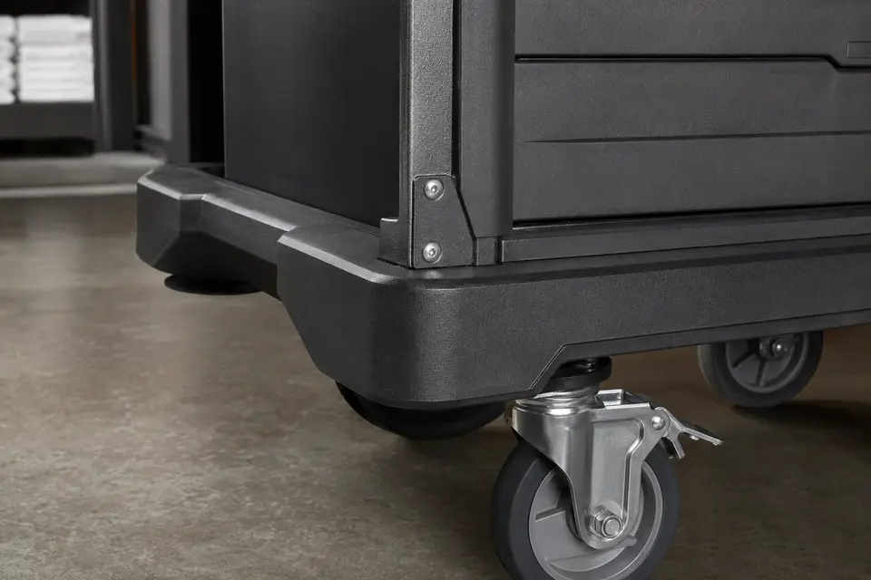Close detail of reinforced cart body, bumper and heavy-duty caster